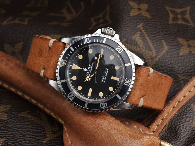 https://magazine.bulangandsons.com/wp-content/uploads/2014/09/BS-W-50-Rolex-5513-Orange-PTag-914-22.jpg